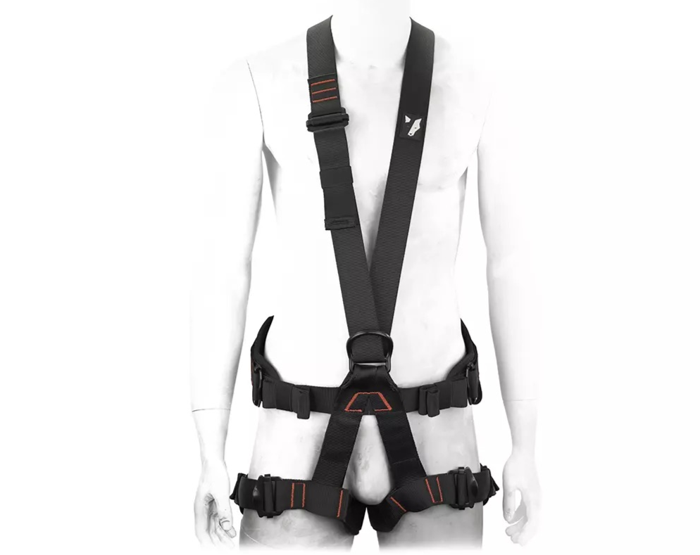 The Cyclone Zipline Harness by Eyolf, showcased on a mannequin, with a sleek black design accented by orange details, equipped with multiple adjustable straps and padding for adventure park activities.
