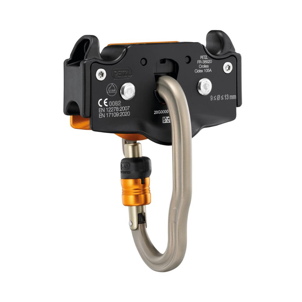 The Petzl Trac Guide trolley, with its distinct orange and silver color scheme, designed for smooth and secure movement along a zip line with an integrated vertigo carabiner. Backside of the trolley